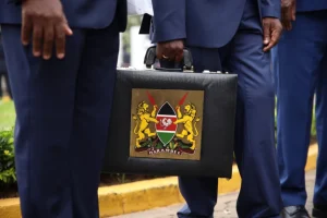 Former National Treasury Cabinet Secretary Njuguna Ndung’u carries iconic briefcase at Parliament Buildings for the reading of the 2023/24 Budget Statement on June 15, 2023. Photo: Jason Mwangi/Citizen Digital.